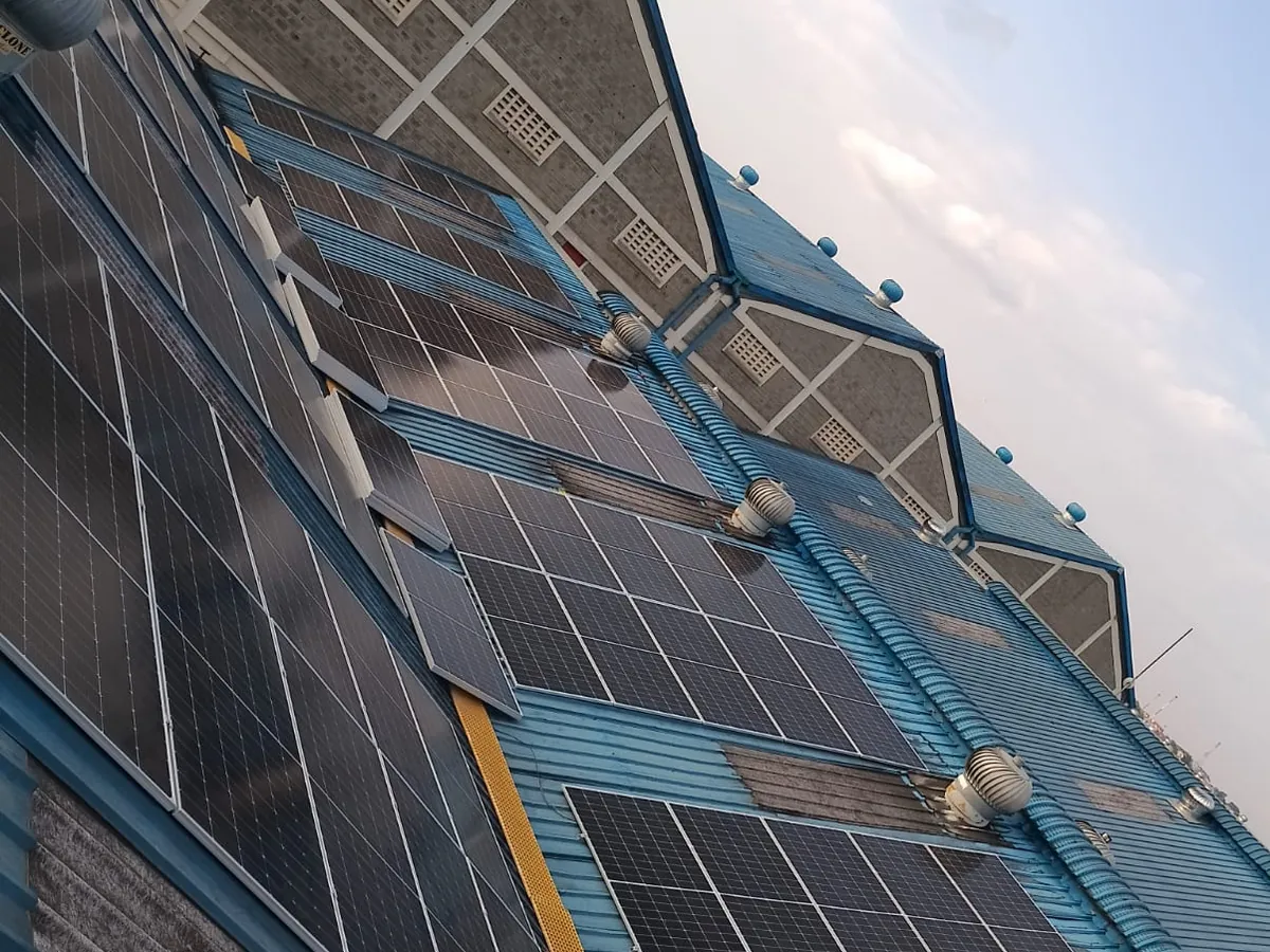 Solar PV panels installed on a commercial building roof and façade